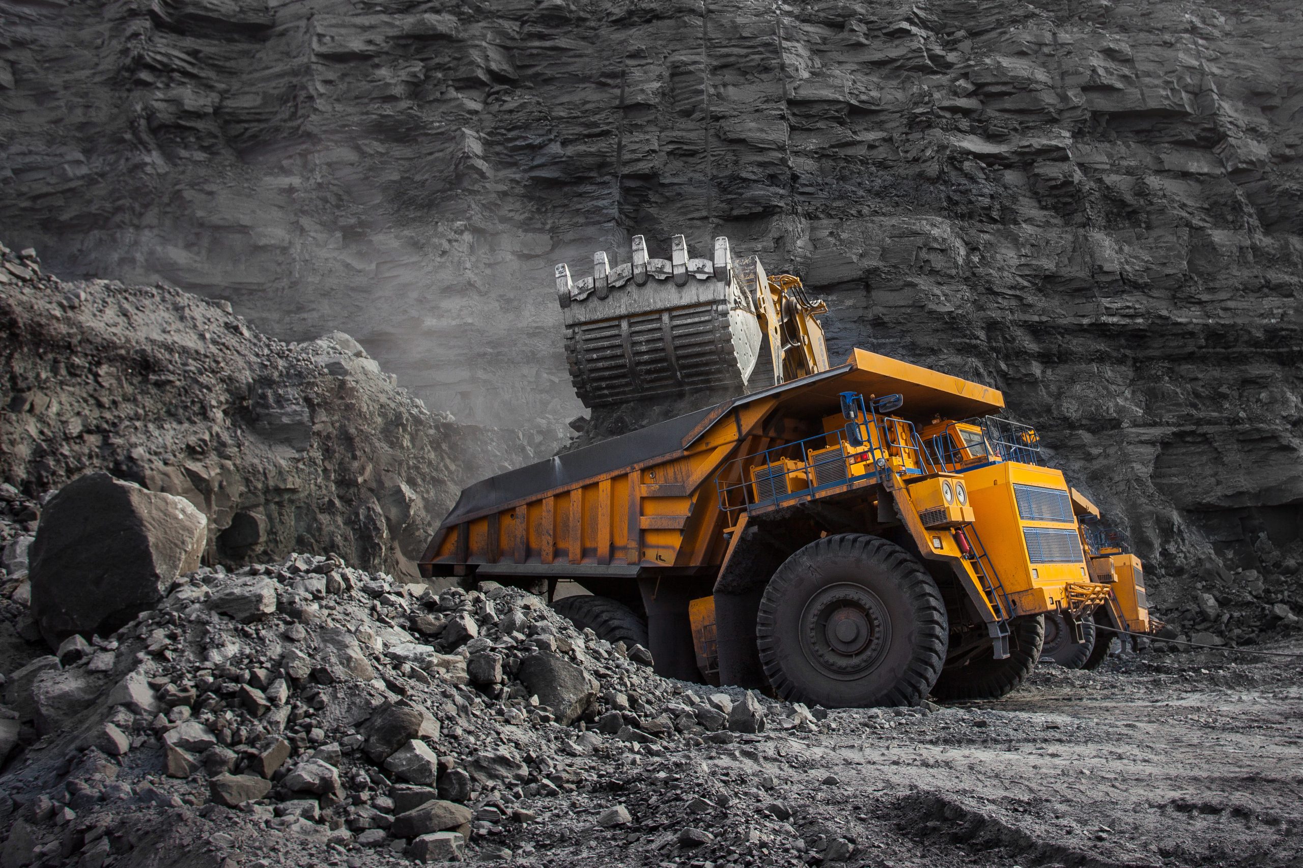 loader bucket on loading coal into a mining truck
